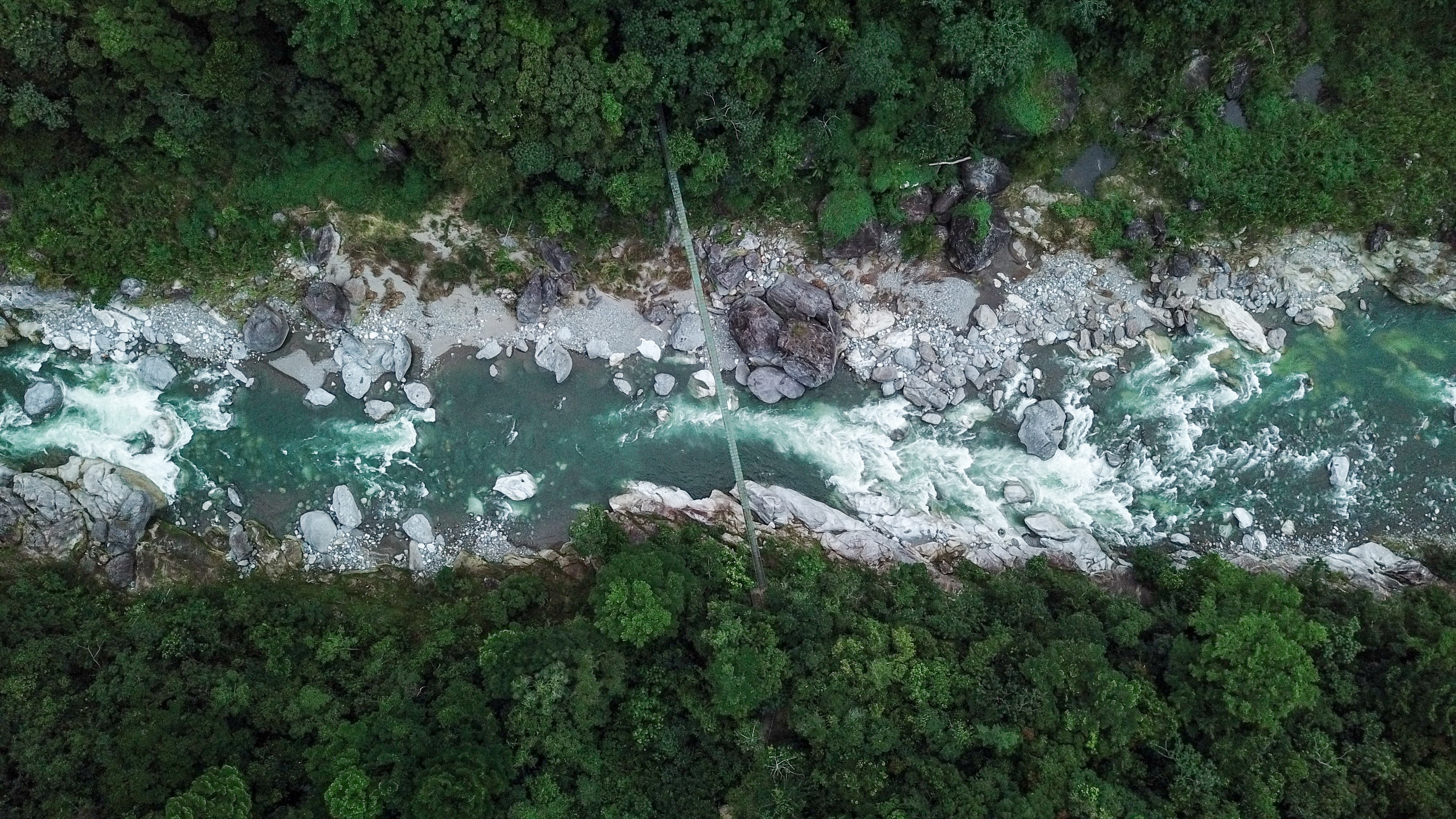 Suspension Bridge Over Rio Cangrejal River In Pico Bonito National Park. Suspension Bridge Over Rio Cangrejal River In Pico Bonito National Park.