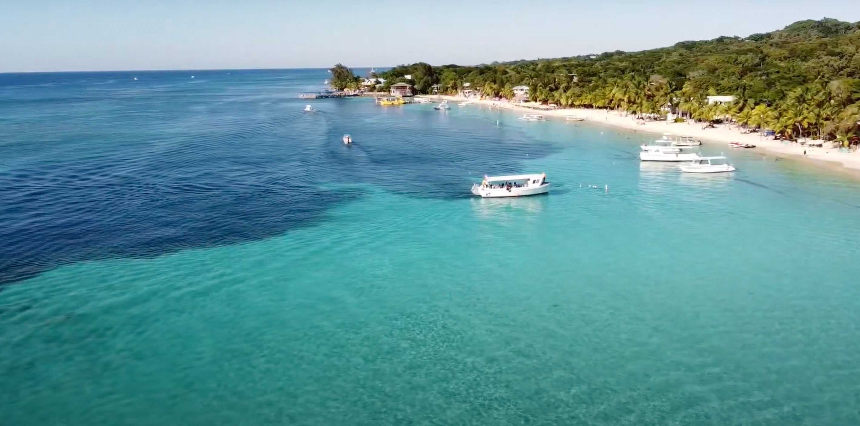 Boats At The Bay On Roatan Island, Honduras Boats At The Bay On Roatan Island, Honduras