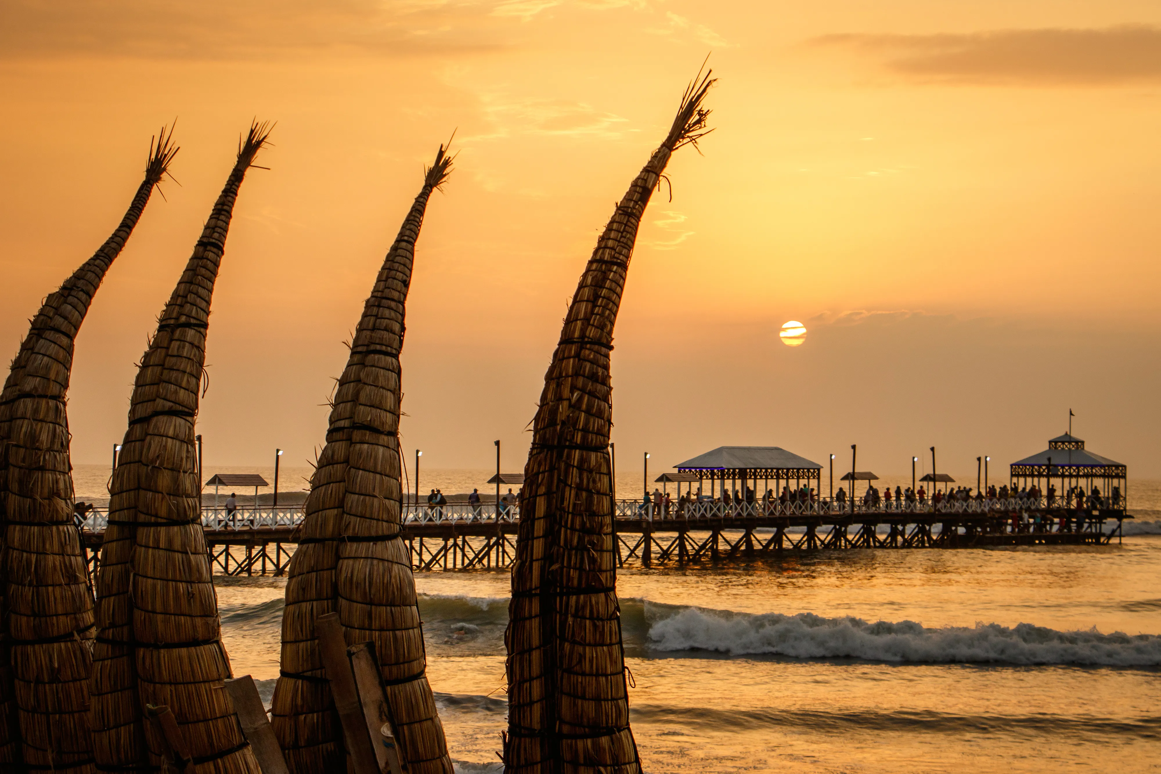 The Sunset With Traditional Boat Craft At Huanchaco Town, Peru The Sunset With Traditional Boat Craft At Huanchaco Town, Peru