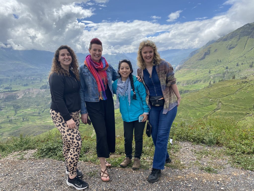 Nicole, Georgia and Milly with their guide backdropped by Colca Canyon