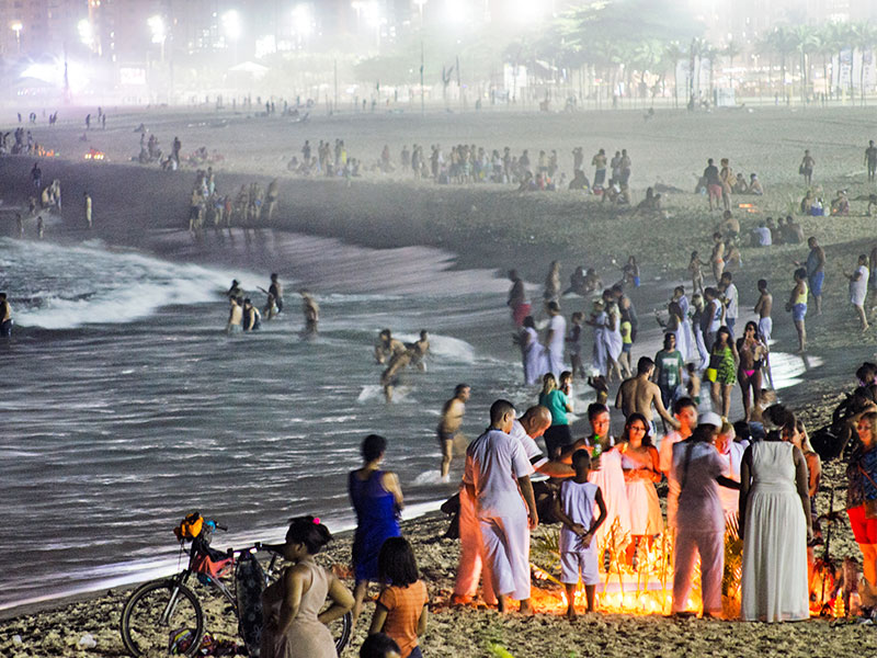 Candle-lighting beachgoers, captured by Lewis on 30th December